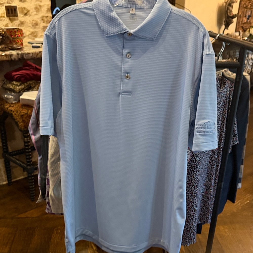 Peter Millar Large Sky Blue Polo Shirt w/Black Jack’s Crossing Lajitas TX logo